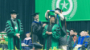 Woman on stage at UNT graduation ceremony